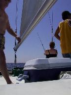 Kathy fishing from the catamaran