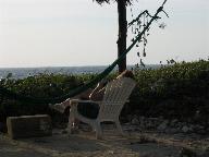 Kathy relaxes under the palapa