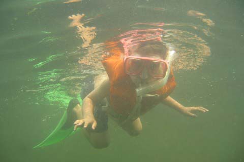 Alec snorkels in Lake Champlain