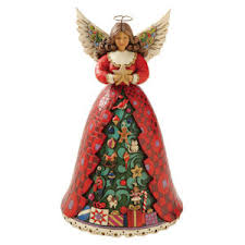 Christmas Spirit Shines Bright Angel
                            plays We Wish You a Merry Christmas